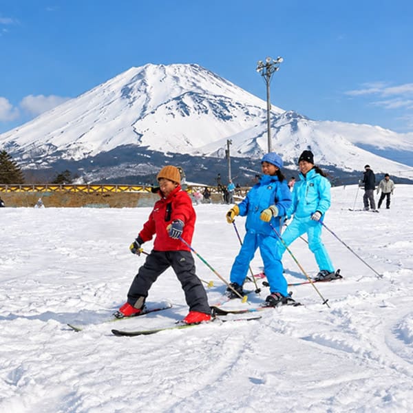 Winter in Japan - Caucasian family enjoying snowy winter vacation