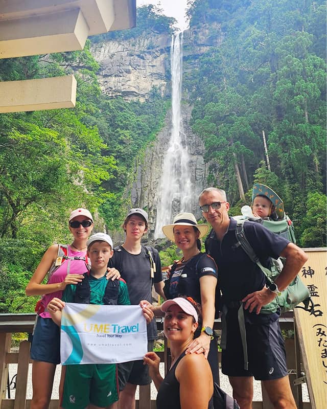 Family travelers exploring peaceful Japan nature waterfalls and cultural sights