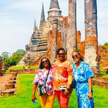 Girls exploring traditional temple architecture