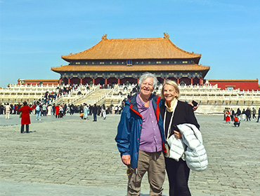 A romantic couple walking together near ancient temple