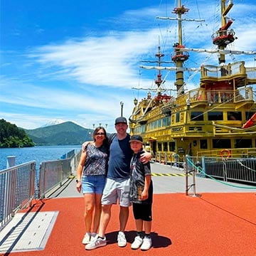 Family photo on Hakone pirate ship with Mount Fuji views in Japan