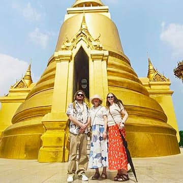 Travelers exploring ancient Ayutthaya ruins and Buddhist temples in Thailand
