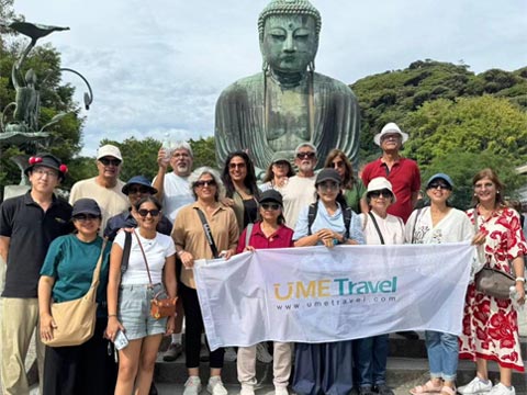 Friends group visiting traditional gate and city